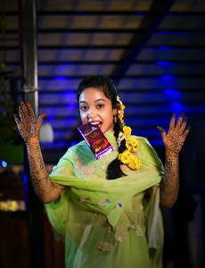 muslim bride mehendi poses, mehendi poses with chocolate, wedding photographer in hbr layout